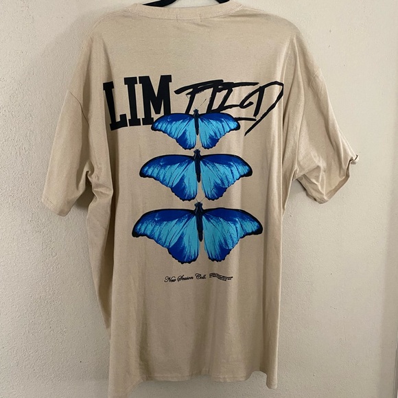REVOLVE Tops - Revolve beige t-shirt with blue butterfly